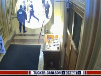 A video still has a spotlight on Missouri Sen. Josh Hawley running in a Capitol hallway on Jan. 6, 2021.