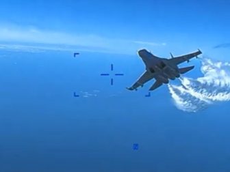 Video released by the Pentagon shows a Russin jet approaching a U.S. drone over the Black Sea.