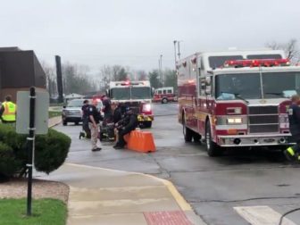 Emergency personnel responding to a reported chemical spill