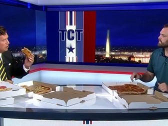 Tucker Carlson eats pizza on the last episode of his Fox News show