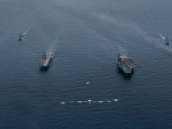 Ships and aircraft from Nimitz Carrier Strike Group and Makin Island Amphibious Ready Group operate in formation in the South China Sea in February.