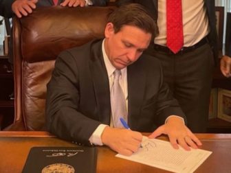 Florida Gov. Ron DeSantis signs legislation giving citizens the right to carry concealed firearms without a permit.