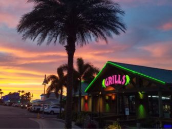 A sunset is seen at Grills Seafood Deck and Tiki Bar is seen in Port Canaveral, Florida, in 2021.