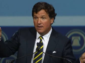 Tucker Carlson speaks at the Heritage Foundation 50th anniversary gala Friday night in National Harbor, Maryland.