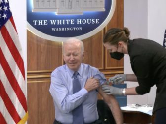 President Joe Biden is seen receiving a COVID-19 shot.