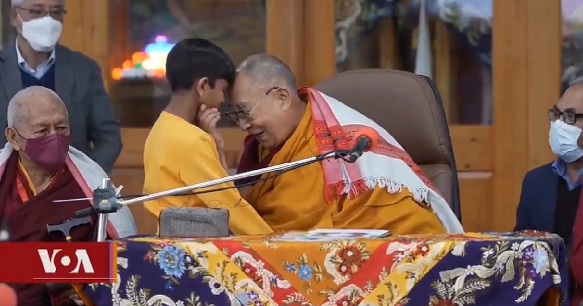 The Dalai Lama is pictured with a young boy in northern India during an encounter that is making news now.