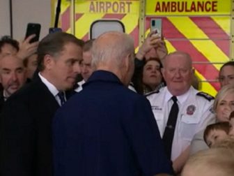 Hunter Biden at his father's side while President Joe Biden is greeted by children at Dublin Airport in Dublin, Ireland, on Wednesday.