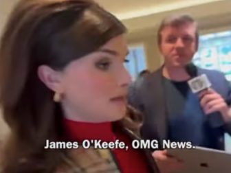 Transgender activist Dylan Mulvaney, foreground, is approached by conservative activist Jame's O'Keefe.