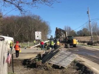 workers cleaning up after a spill of toxic soil