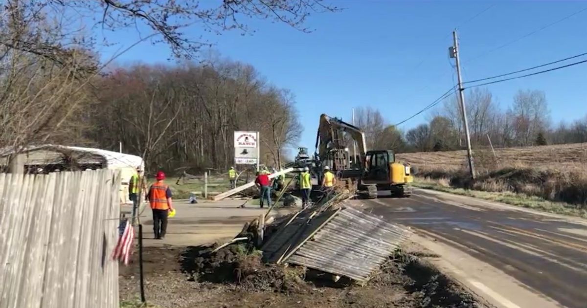 workers cleaning up after a spill of toxic soil