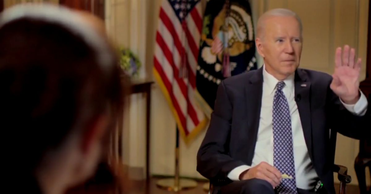 President Joe Biden gestures to a staffer who was trying to interrupt during an interview broadcast Friday with MSNBC's Stephanie Ruhle.