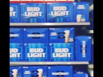 Bud light beer is seen on shelves.