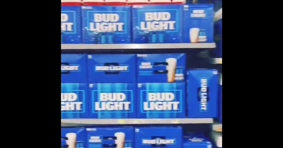 Bud light beer is seen on shelves.