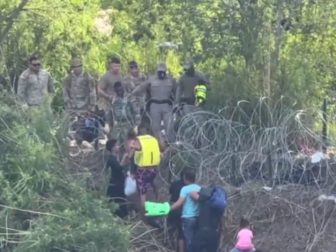 Texas Department of Public Safety and the National Guard was filmed as they stopped migrants from entering.