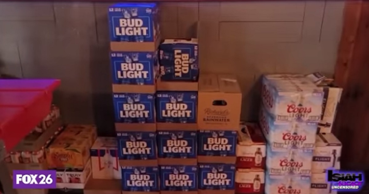 Cases of unsold Bud Light are stacked against a wall at a Houston restaurant.