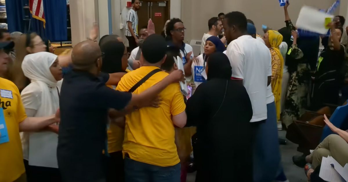 During the Minneapolis DFL Ward 10 meeting scheduled to chose a city council nominee, Council Member Aisha Chughtai and her supporters took the stage for her speech, then Nasri Warsame supporters advanced towards the stage, and began pushing and shoving.