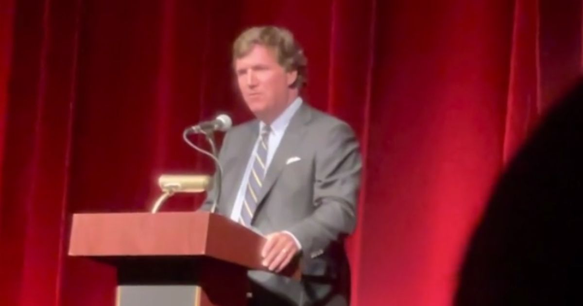 Tucker Carlson speaks at the Oxford Performing Arts Center in Oxford, Alabama, on Thursday.