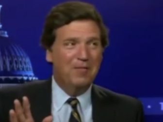 Tucker Carlson is seen in a behind-the-scenes video.