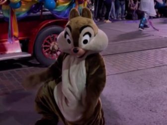 Some questioned the propriety of a dance by the costumed Disney character "Chip" during the theme park's "pride parade."