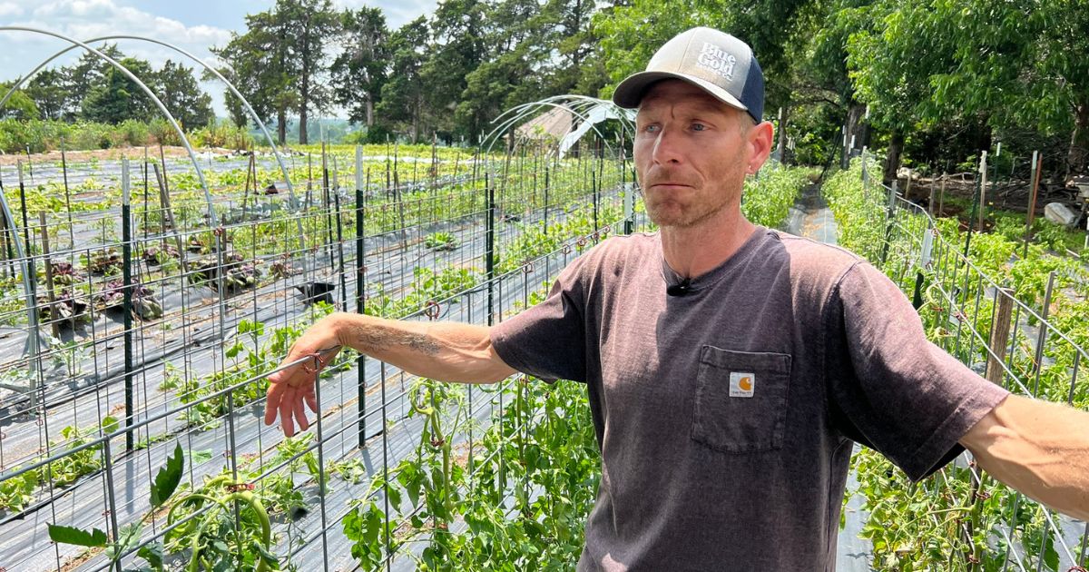 Michael Ruzycki talks to a reporter on his two-acre vegetable farm in Jones, Oklahoma.