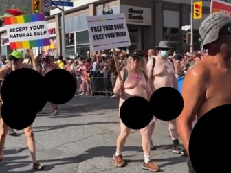 Naked men walk in Toronto's "pride" parade Sunday.