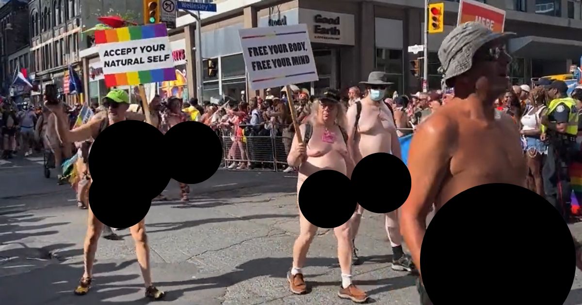 Naked men walk in Toronto's "pride" parade Sunday.