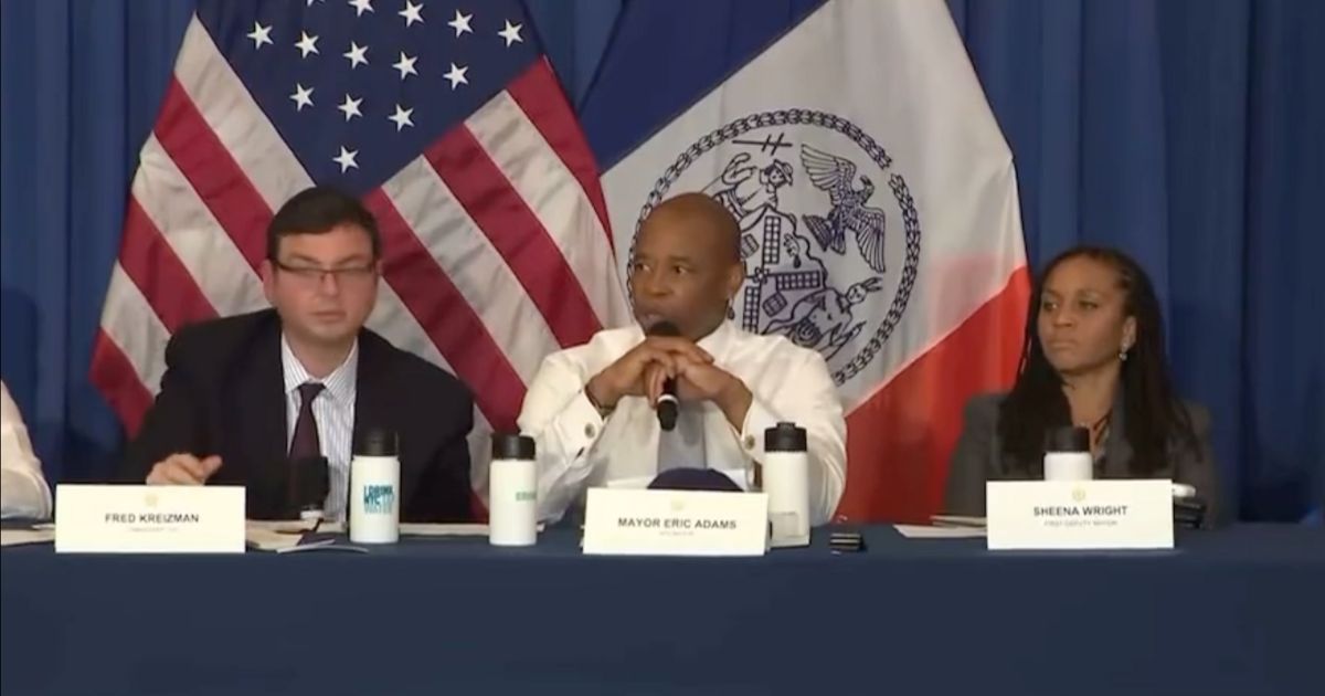 Eric Adams, mayor of New York City, center, went off on a woman during last night’s town hall meeting.