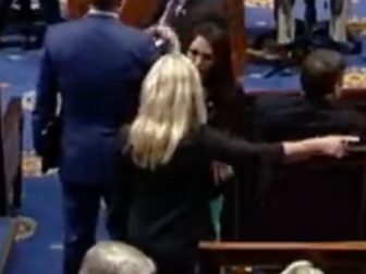 Reps. Marjorite Taylor Greene and Lauren Boebert appear to argue on the House floor in a C-SPAN video on Wednesday.