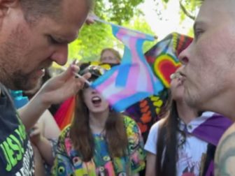 Attendees of a "pride" fest surround a street preacher in Seattle.