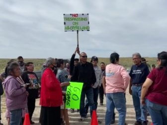 Individuals are seen protesting President Joe Biden's drilling ban.