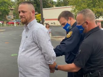 Gabriel Rench is arrested during a "psalm sing" protest in Moscow, Idaho, in 2020.