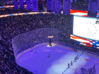 The crowd at a game for the Toronto Maple Leafs sing "The Star Spangled Banner" at Scotiabank Arena in Toronto, on March 13.