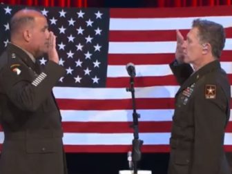 Army Gen. Andrew Poppas, left, swears in country star Craig Moran for another tour with the U.S. Army Reserves on Saturday at the Grand Ole Opry in Nashville. (ChiefUSAR / Twitter)