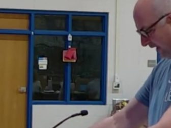 A dad throws chicken feed at a South Carolina school board to protest sexually explicit books.