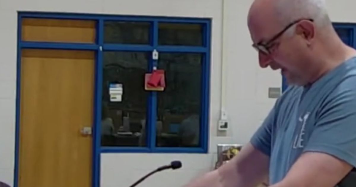 A dad throws chicken feed at a South Carolina school board to protest sexually explicit books.