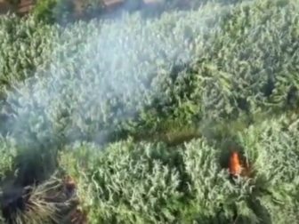 A police drone in Italy shows a man allegedly setting fires.