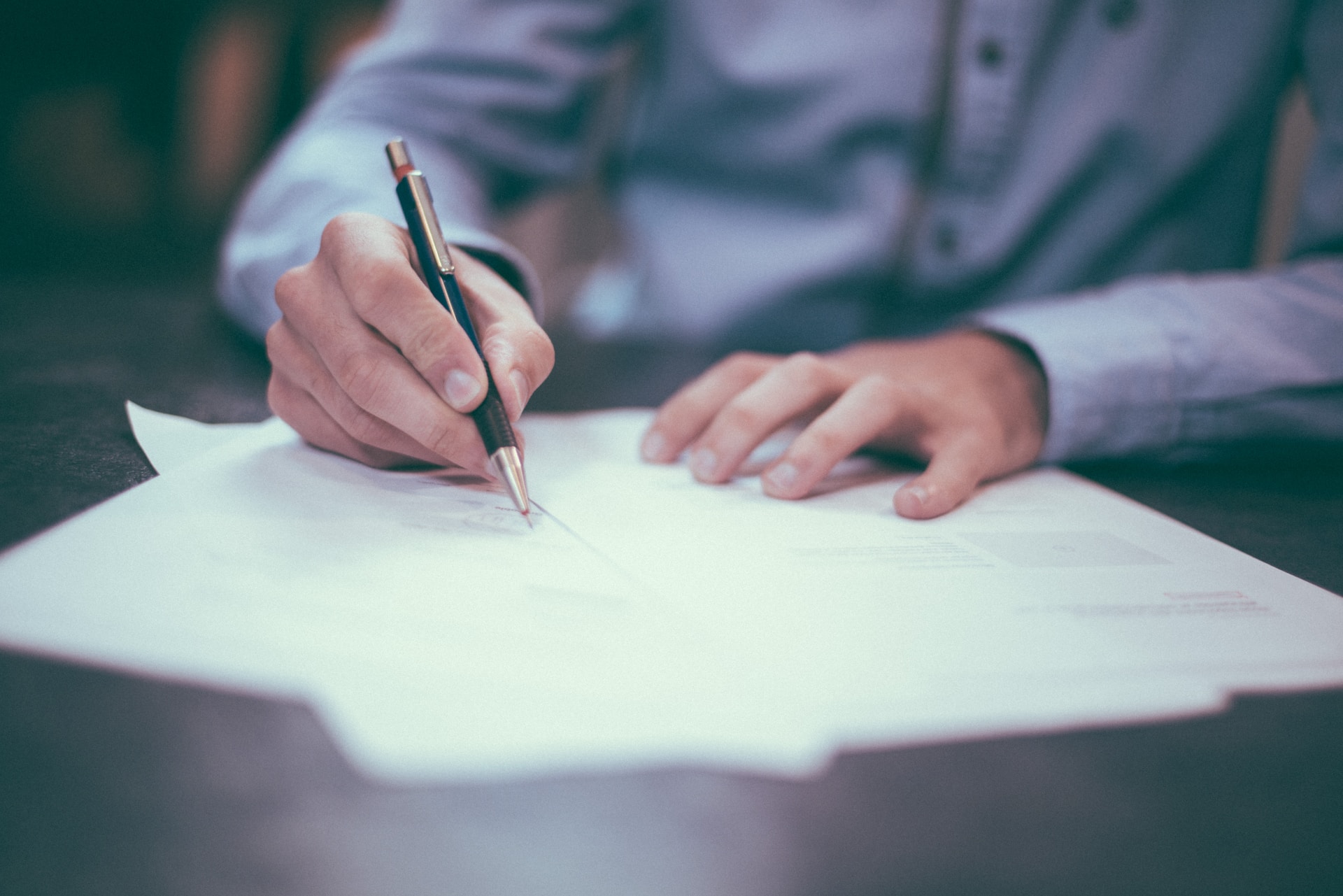 man writing on paper, science, research