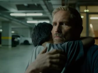 Actor Jim Caviezel hugs a boy he's saved from human traffickers in "Sound of Freedom," movie that's taking on Hollywood's giants.