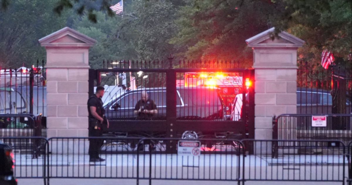 HAZMAT crews are pictured behind the gates on West Executive outside the entrance to the West Wing in Washington D.C., on Sunday.