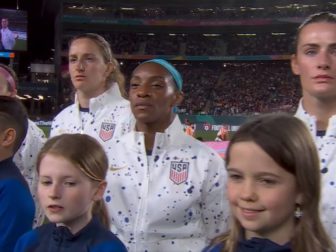 The U.S. women's national soccer team stands in line during the National Anthem before their World Cup game against Portugal on Tuesday.