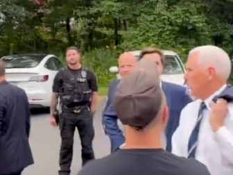 Former Vice President Mike Pence turns to confront a heckler on Friday in Londonderry, New Hampshire.