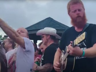 Oliver Anthony, right, joined Shinedown and Papa Roach for an impromptu acoustic concert after a Virginia music festival was cancelled due to severe weather.