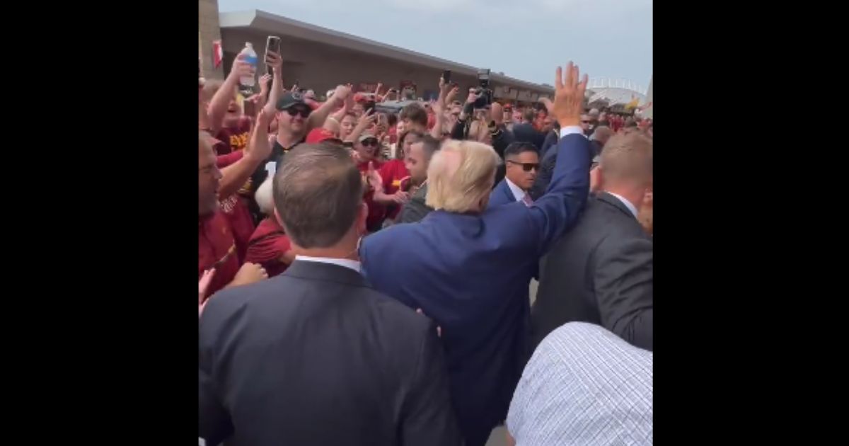 Former President Donald Trump arrives at Jack Trice Stadium for a football game between the University of Iowa and Iowa State University on Saturday.