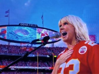 Christian artist Natalie Grant sings the national anthem before the NFL's season opener Thursday at Arrowhead Stadium in Kansas City.