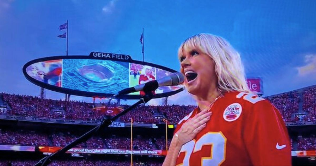 Christian artist Natalie Grant sings the national anthem before the NFL's season opener Thursday at Arrowhead Stadium in Kansas City.