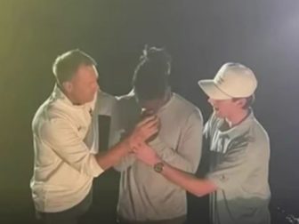 Someone is seen getting baptized at Auburn University.