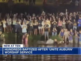 Worshippers gather for a mass baptism Tuesday at Auburn University.