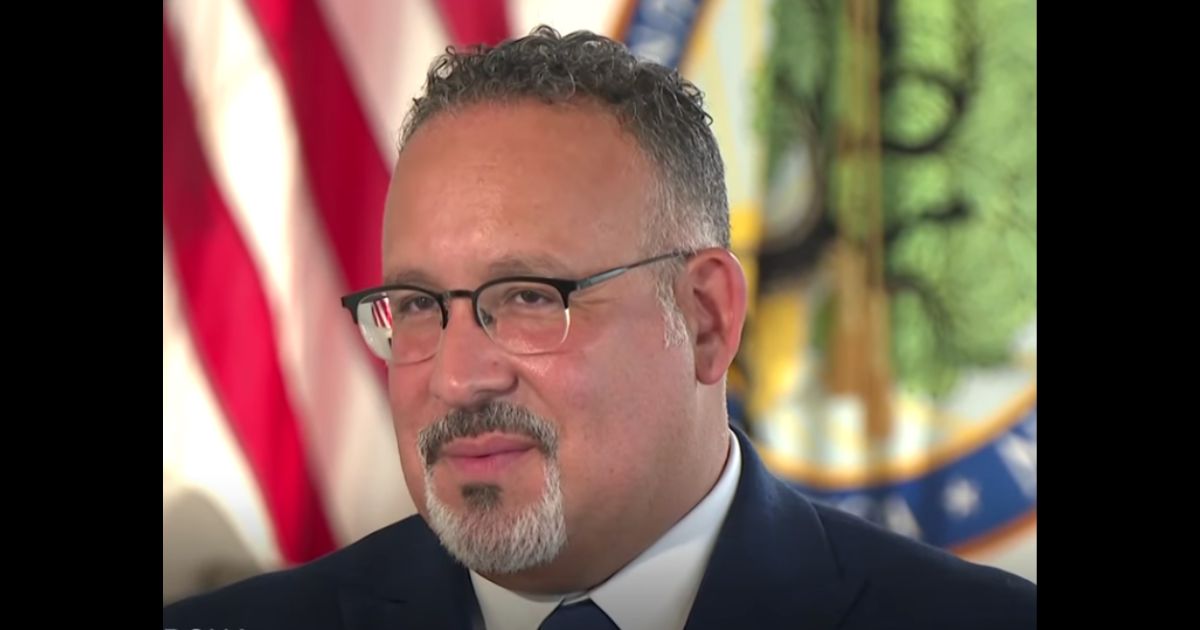 Education Secretary Miguel Cardona speaks to the Associated Press on Friday.