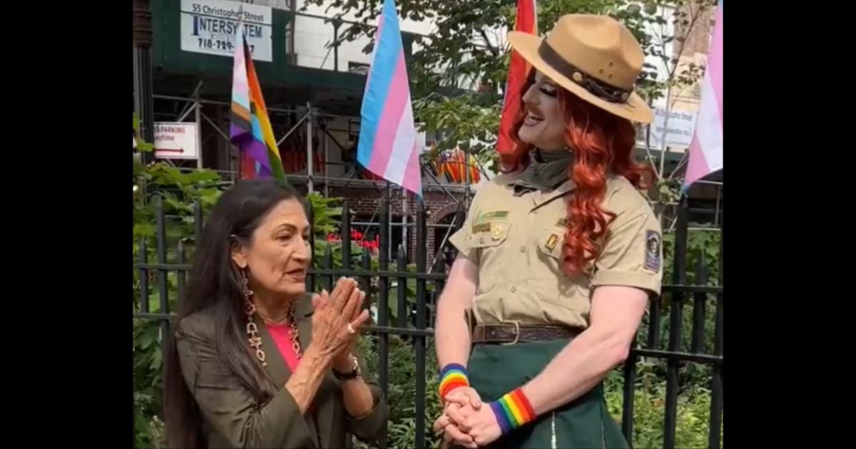 Interior Secretary Deb Haaland with a park ranger identified as "Pattie Gonia."