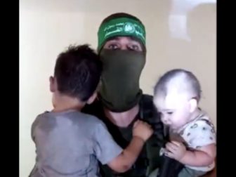 Hamas has released a video of militants holding Israeli children.